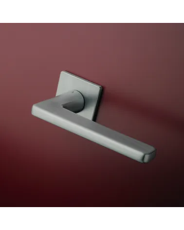 Satin chrome SETIA door handle design handle mounted on a door