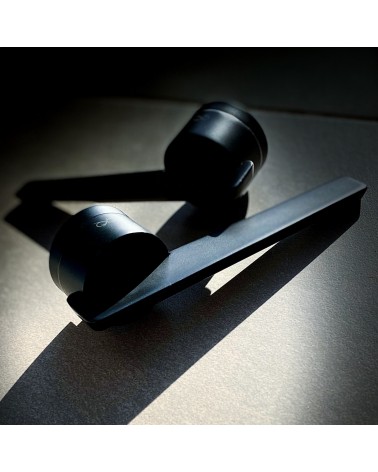 JUMELLE black door handle design handle on black background