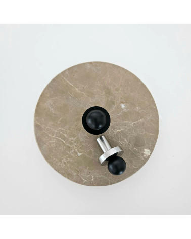 POLA black/polished chrome furniture knob designer pull top view placed on a round marble plate
