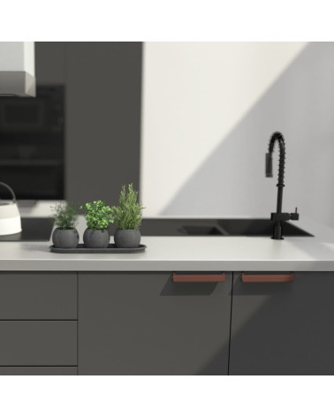 PRATO-2 designer furniture handle in aged copper mounted on a kitchen unit