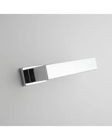 Polished chrome door handle PINA design handle angled bottom view mounted on a door