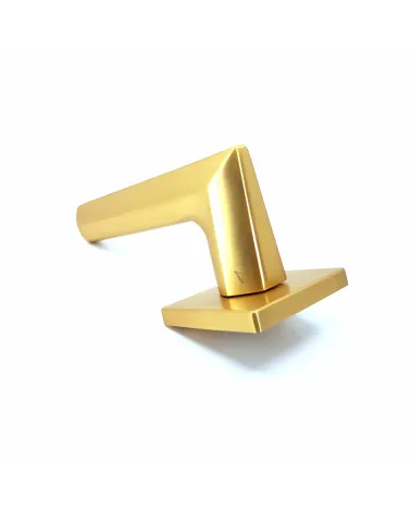 Matt gold JASMINA door handle design handle fitted on a flat surface