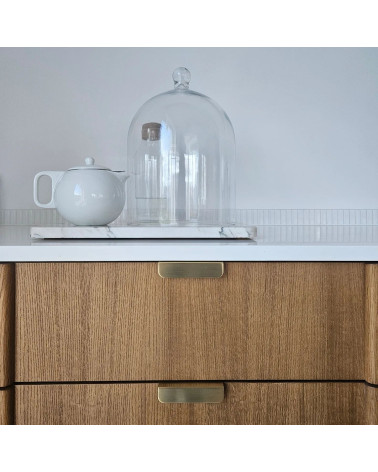Matt gold EDIT EDGE furniture handle designer handle front view installed on drawer