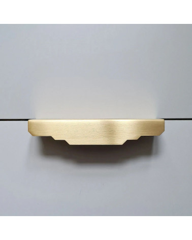 Brushed brass Karla Edge furniture handle bedroom handle front view on a light background
