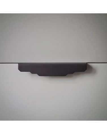 KARLA BLACK brass furniture handle design fixed on a light surface