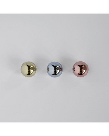 ODETE M copper furniture knob design handle top view aligned in diagonal perspective on a light surface