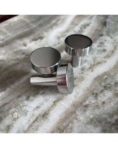 NENA polished chrome furniture knob design handle zoomed view placed on a marbled surface