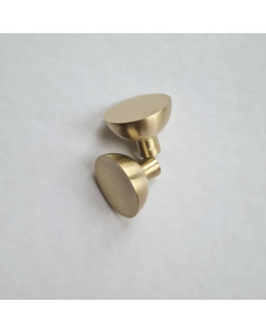 LUNA M matte gold furniture knob design placed side by side on a flat surface