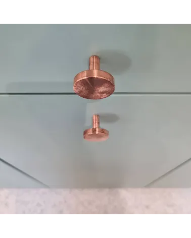 NENA M brass furniture knob designer handle top view mounted on a piece of furniture
