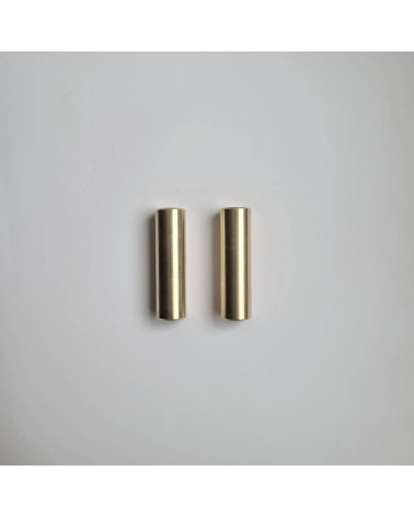 SIV M brass furniture handle designer handle arranged parallel on a grey surface