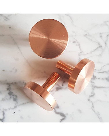 NENA M brass furniture knob designer handle placed on a marbled surface