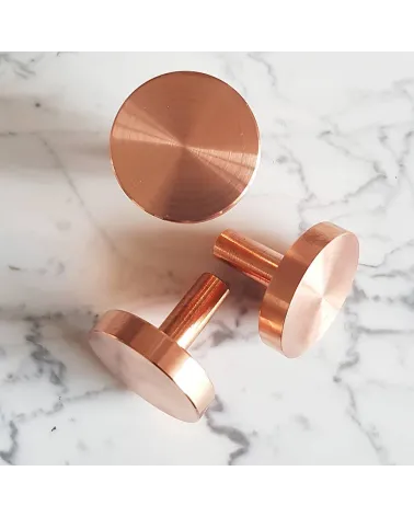 NENA M brass furniture knob designer handle placed on a marbled surface