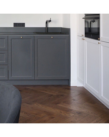 Brass VERA S furniture knob designer handle installed on a cabinet