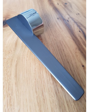 JUMELLE zamak door handle design handle angled view placed on a plate