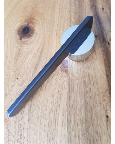 JUMELLE zamak door handle design handle angled top view placed on a plate