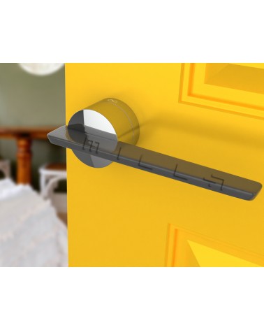 JUMELLE zamak door handle design handle angled view mounted on a door