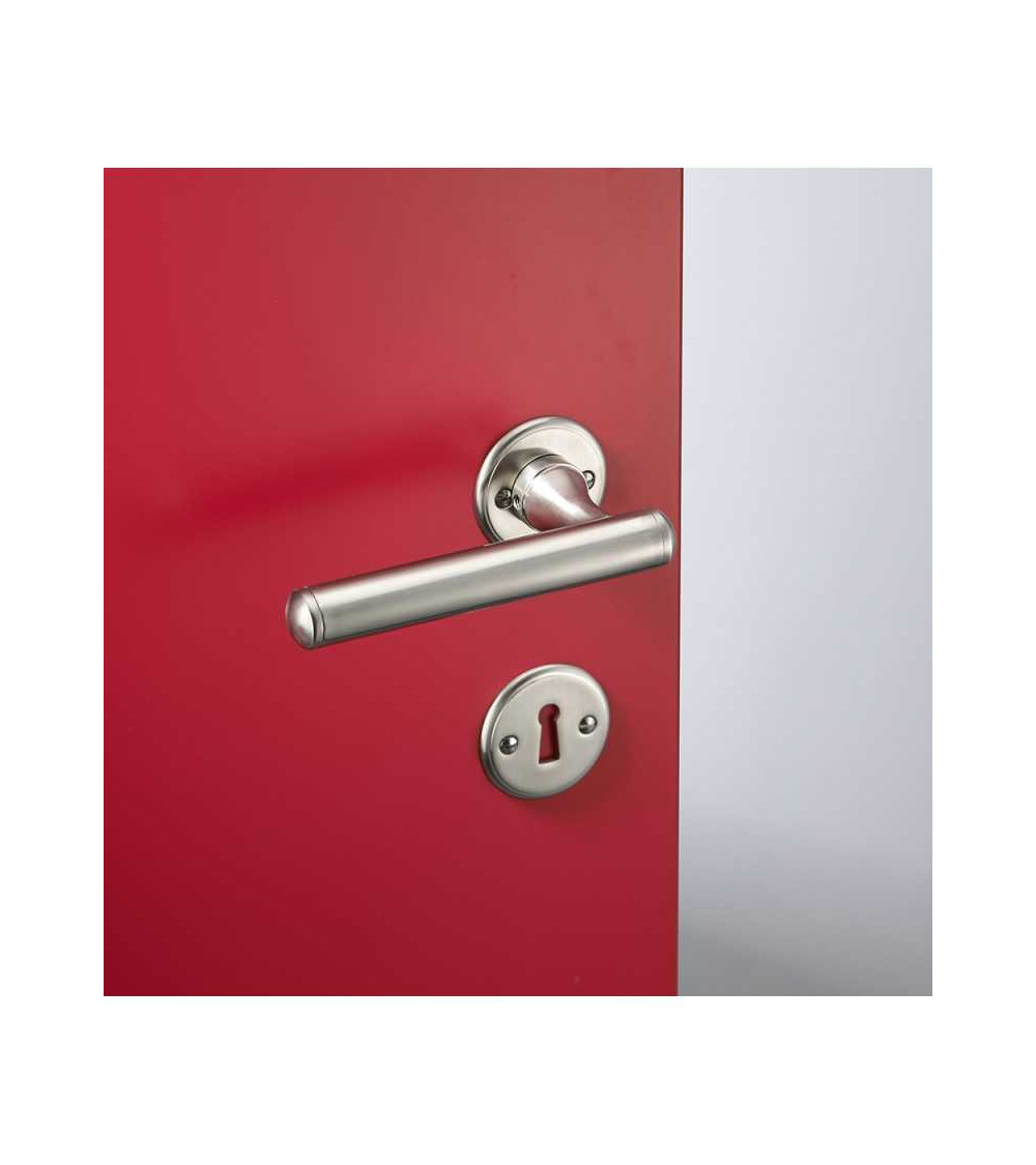Rounded brass door handle set on round rose