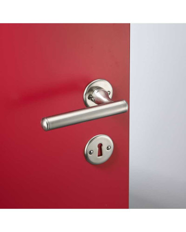 Rounded brass door handle set on round rose