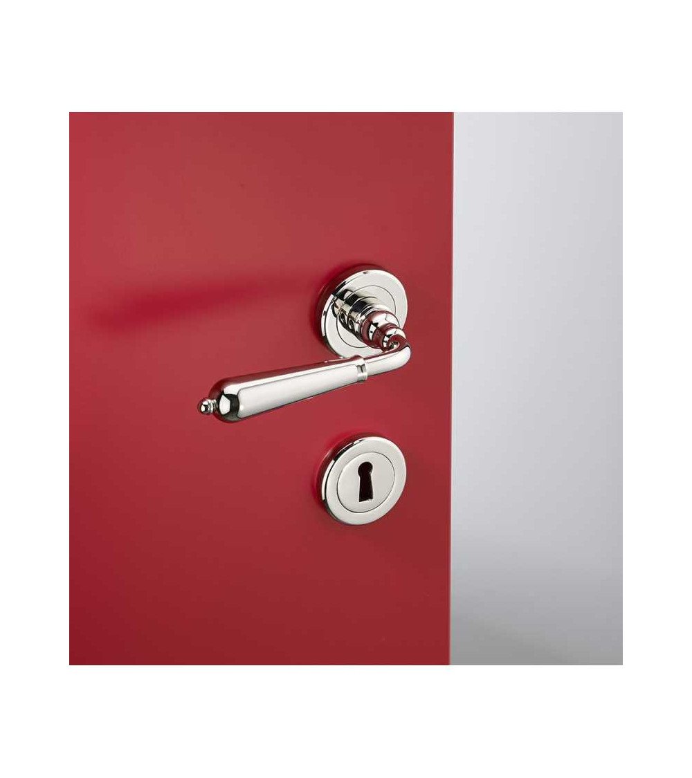 Modern brass door handle set on round rose