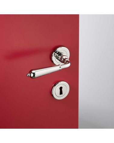 Modern brass door handle set on round rose