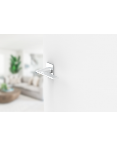 Polished chrome Harmony door handle design handle top view mounted on a door