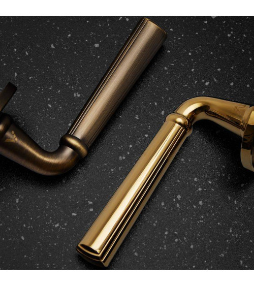 Retro CASCADA door handle on round plate - designer handle