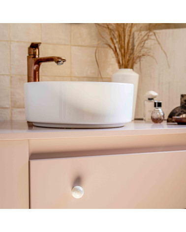Grey beech wood furniture knob designer handle fitted on a pink cabinet