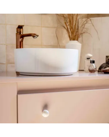 Grey beech wood furniture knob designer handle fitted on a pink cabinet