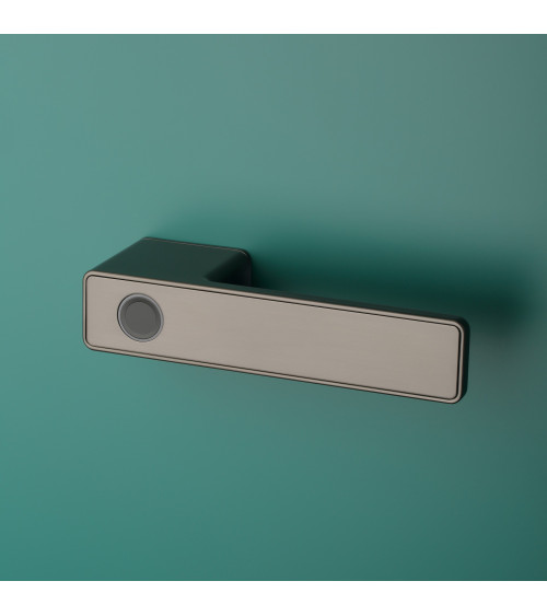 MAHONIA modern electronic door handle designer handle for right-handed held by a hand