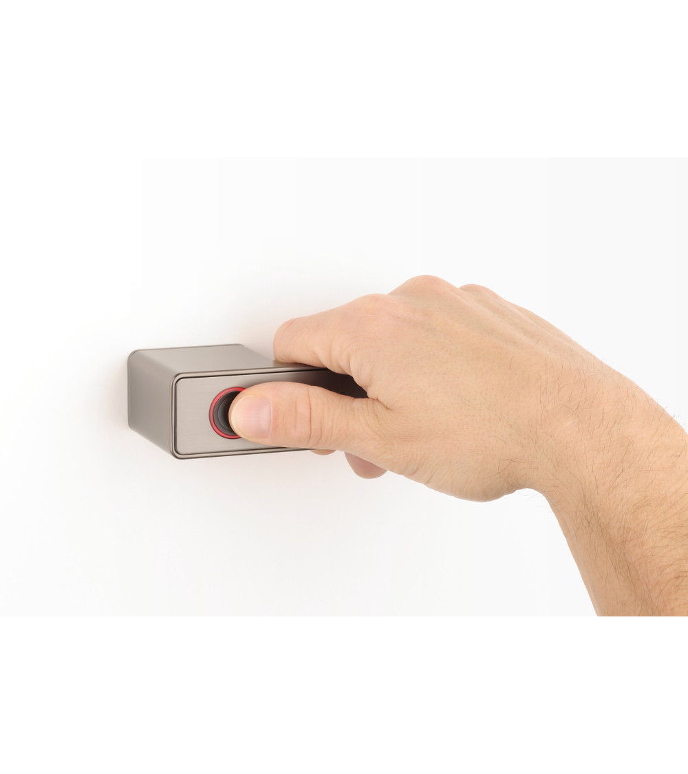 MAHONIA modern electronic door handle designer handle for right-handed held by a hand