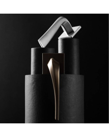 Heavy door handle designer hardware placed on a dark background