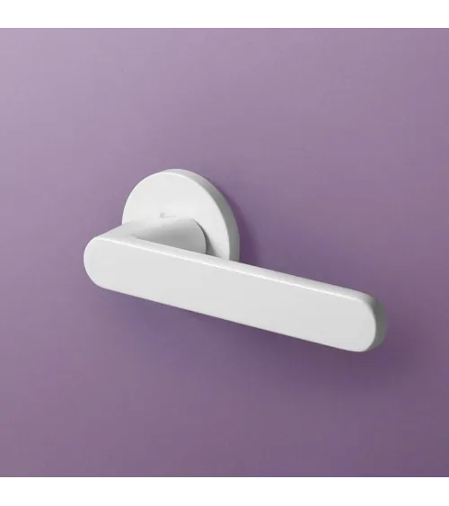 Nesh white door handle designer ironmongery