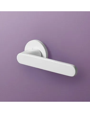 Nesh white door handle designer ironmongery front view mounted on a plate