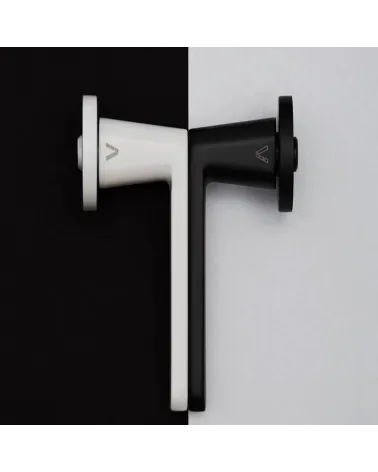 Nesh door handle designer ironmongery side view on a two-tone background