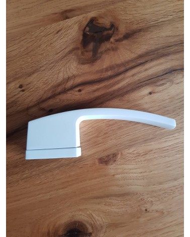 Zamak Arc door handle designer handle side view placed on a plate