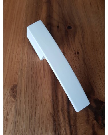 Zamak Arc door handle designer handle top tilted view placed on a plate