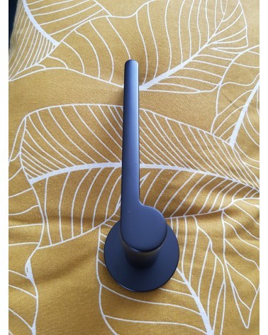 Zamak Pandora door handle designer handle profile view placed on a patterned background