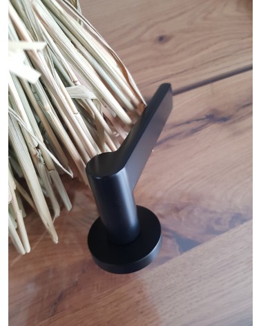 Zamak Pandora door handle designer handle slightly angled top view placed on a plate
