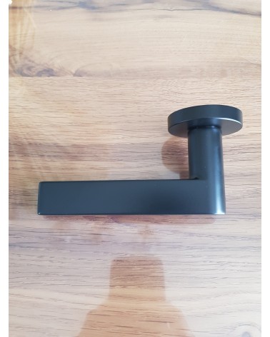 Zamak Pandora door handle designer handle side view placed on a plate