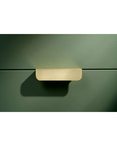 EDIT EDGE matt gold furniture handle designer handle mounted horizontally on a background