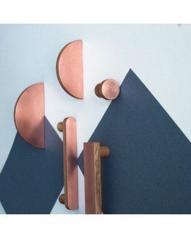 Circular wooden and copper furniture handles