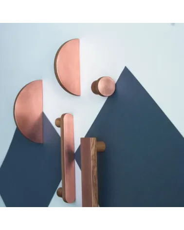 Circular wooden and copper furniture handles