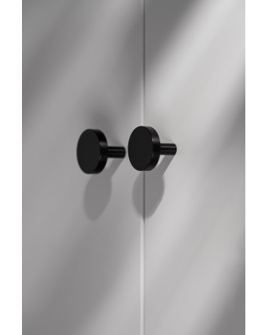 Black NENA M furniture knob, design handle, side view mounted on furniture