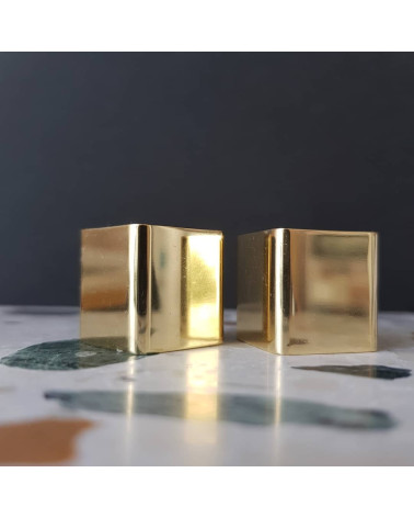 Brass ODETE furniture knob LANA S design handle zoomed view placed on a stone surface