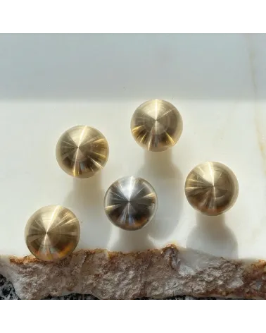 Brass furniture knob model 03 design handle top view on a marble surface