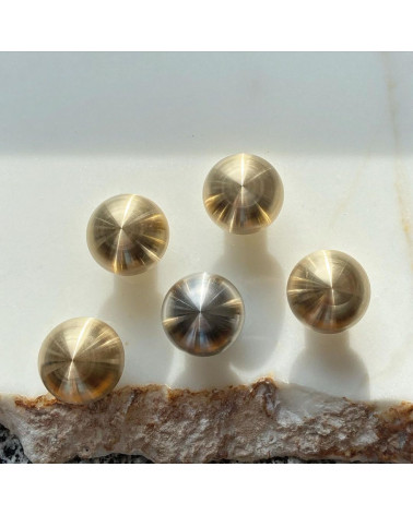 Brass furniture knob model 03 design handle top view on a marble surface