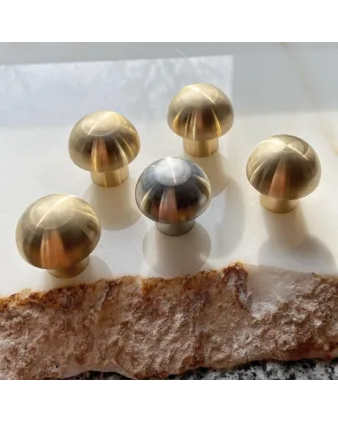 Brass furniture knob model 03 design handle front view on a marble surface