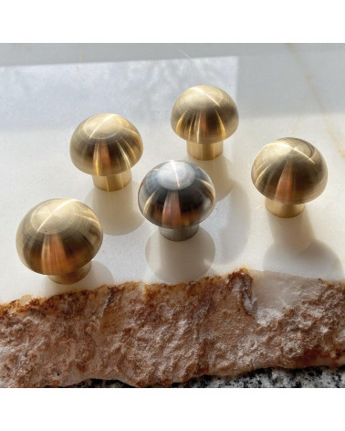 Stainless steel furniture knob 03 designer handle front view on a marble surface