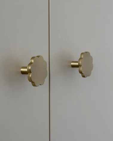 Brass furniture knob Flower 08 designer handle side view installed on a cupboard