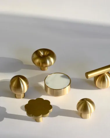 Brass furniture knob Flower 08 designer handle top view with other knobs